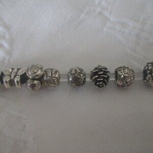 Lot of 8 sterling silver bracelet beads/charms, incl. Trollbeads